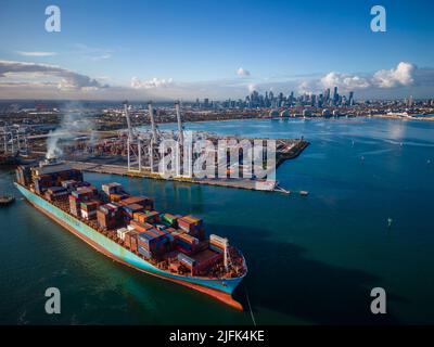 Aerial view of a cargo ship departing from the Port of Burgas, leaving ...
