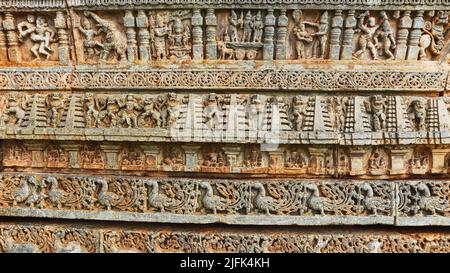 Carvings of Peacock and War Scenes on the Sri Lakshminarayana Temple, Hosaholalu, Mandya, Karnataka, India. Stock Photo