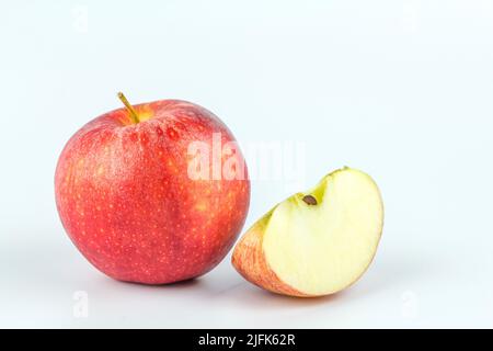Sliced red apple isolated on white background. Stock Photo