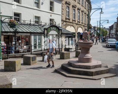 Town centre street scene in summer in the spa town of Buxton, Peak District, Derbyshire, UK Stock Photo