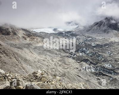 Low May clouds over the Khumbu glacier near Gorak Shep. The  Khumbu Icefall is the large white patch in the bg. Stock Photo