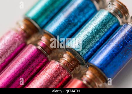 set of glitters in bottles over white background Stock Photo