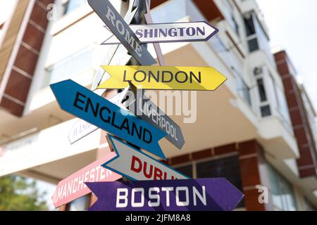 Tourist signs of cities and countries with directions Stock Photo