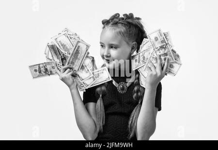 pretty teen girl with pigtails has lots of money isolated on white, dollar Stock Photo