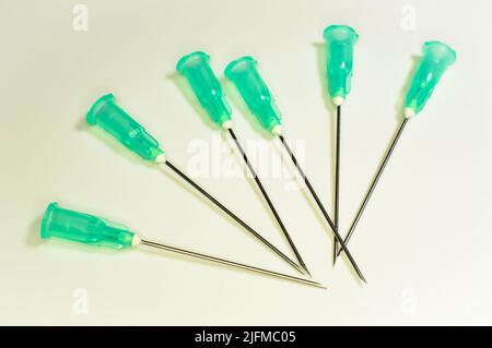 Medical syringe's needles compilation on a white background. Social problems.  Drugs and medical treatment. Stock Photo