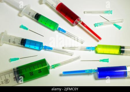 Medical syringes compilation with needles on a white background. Social problems. Vaccines against corona virus and monkeypox. Drugs and medicine. Stock Photo