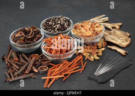 Chinese acupuncture needles for alternative therapy. Used with herbs and spice in natural healing remedies. Oriental health care concept. Stock Photo
