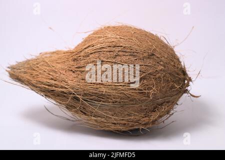 Isolated natural coconut with coir on white background Stock Photo