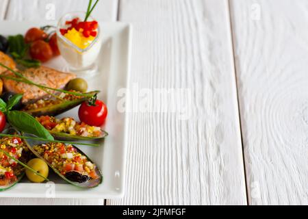 Turkish cuisine - stuffed mussels and salmon void Stock Photo