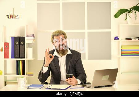 working from home while virus epidemic. handsome CEO. Busy mature man in office. Businessman with computer. businessman in office. employee during Stock Photo