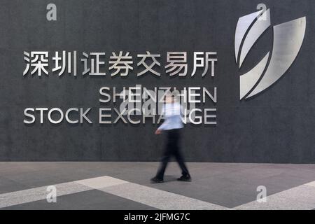 Beijing, China's Guangdong Province. 21st Sep, 2020. A staff member walks past the Shenzhen Stock Exchange in Shenzhen, south China's Guangdong Province, Sept. 21, 2020. Credit: Mao Siqian/Xinhua/Alamy Live News Stock Photo