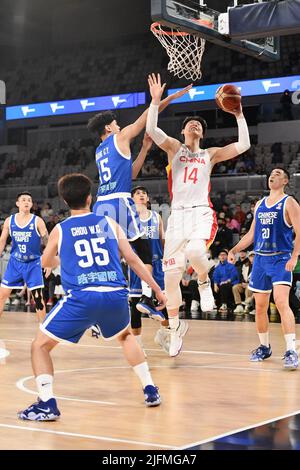 Melbourne, Australia. 4th July, 2022. Wang Zhelin (top R) of China goes for a lay-up during a Group B match between China and Chinese Taipei of the FIBA World Cup Asian qualifiers in Melbourne, Australia, July 4, 2022. Credit: Bai Xue/Xinhua/Alamy Live News Stock Photo