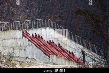 Kiev, Ukraine December 10, 2020: Concrete wall with props to protect the mountain from landslides Stock Photo