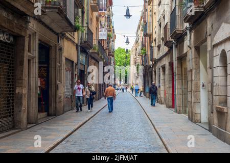 Narrow street amidst buildings in town Stock Photo