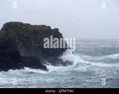 Waves breaking on Burroo, calf of Man, Isle of Man Stock Photo