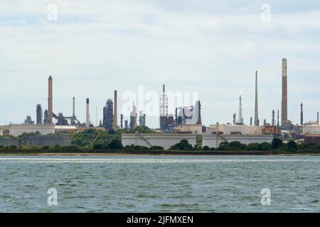 Fawley, Hampshire, UK.  4th July 2022.  General view of the Fawley Oil Refinery which sits on the banks of Southampton Water near Southampton in Hampshire which is owned by the ESSO Petroleum Company.  Picture Credit: Graham Hunt/Alamy Live News Stock Photo