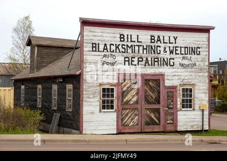 Exterior of the historic 1911 Bill Bally Blacksmithing & Welding Repairing shop in Grand Marais, Minnesota Stock Photo