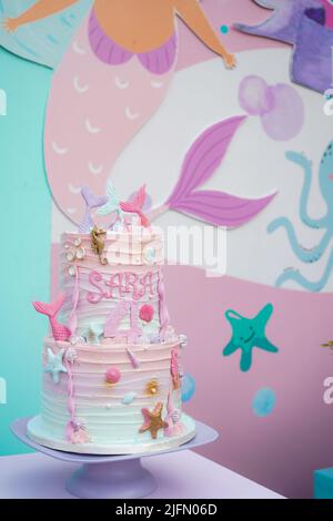 Mermaid birthday cake decorated with seashells and sea stars, Mermaid Birthday Party cake, Sara's 4th Birthday Stock Photo