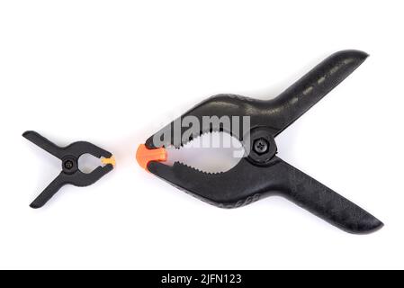 Big and small plastic clamp on a white background Stock Photo