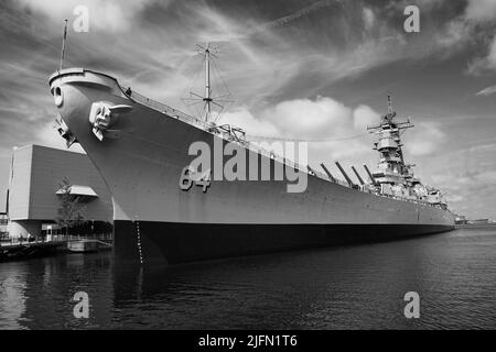 Side-View of the USS Wisconsin (BB-64) at its berthed in Norfolk, VA. The USS Wisconsin is adjacent to Nauticus, The National Maritime Center. Stock Photo