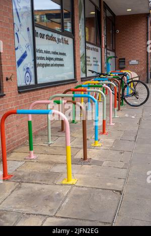 Brightly coloured cycle rack outside of The Art House art gallery and cultural centre in Wakefield, UK. Stock Photo