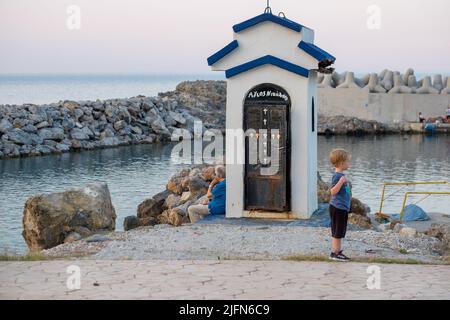 Old Man Fishing with Little Boy