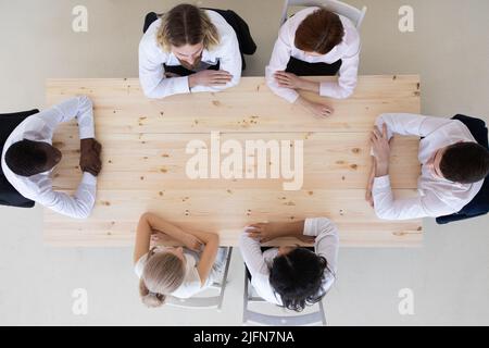 Businessteam working at empty meeting table, top view, copy space for text Stock Photo