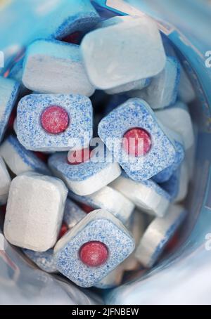 Finish dishwasher detergent at a dishwasher in a kitchen in a home. Stock Photo