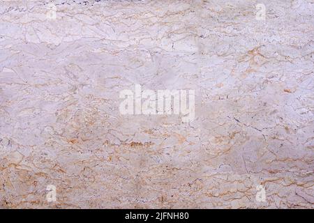 Textured wall lined with shell rock tiles. Stock Photo