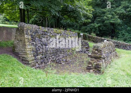 Example of retaining and training dry walls, part of a dry stone walling exhibit, Shibden Park, Halifax, Yorkshire, UK. Stock Photo