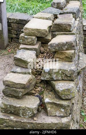 Example of the inside design of a dry stone wall, part of a dry stone walling exhibit, Shibden Park, Halifax, Yorkshire, UK. Stock Photo