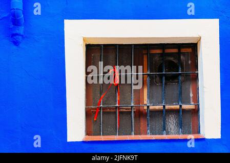 White framed window on blue facade. Calatayud, Zaragoza, Aragón, Spain, Europe Stock Photo