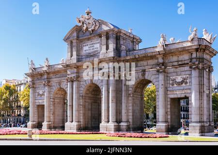 The Puerta de Alcalá is one of the five old royal gates that gave access to the city of Madrid, is a Neo-classical gate in the Plaza de la Independenc Stock Photo