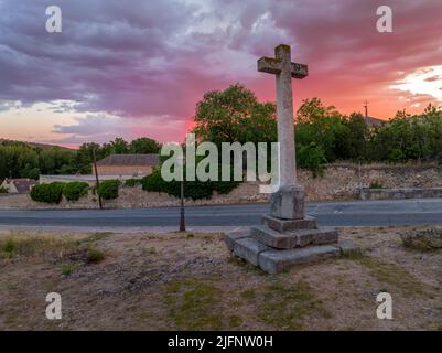 Gorgeous sunset with colorful sky above Segovia Alcazar and Iglesia de la vera cruz  Romanesque church in Spain Stock Photo