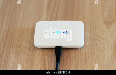 Modern wireless pocket 4g wifi modem. Stock Photo