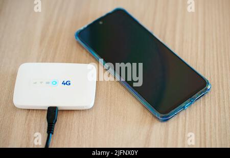 Modern wireless pocket 4g wifi modem. Stock Photo