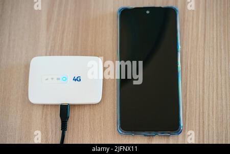 Modern wireless pocket 4g wifi modem. Stock Photo