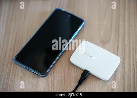 Modern wireless pocket 4g wifi modem. Stock Photo