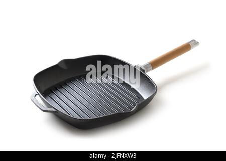 Empty cast iron grill pan with handle isolated on white background. Stock Photo