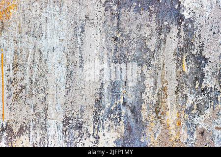 Old rough concrete peeling wall. Dirty damaged texture, peeling plaster, damaged wall. Vintage background Stock Photo