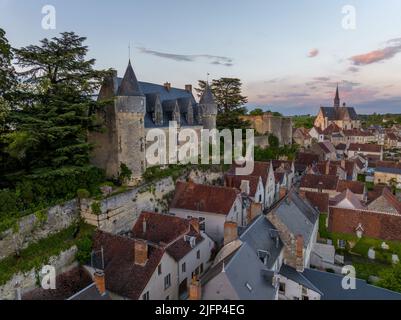 Aerial sunset view of Montresor medieval castle with a Renaissance mansion in Indre et Loire, on a rocky overhand dominating the valley, on of the mos Stock Photo