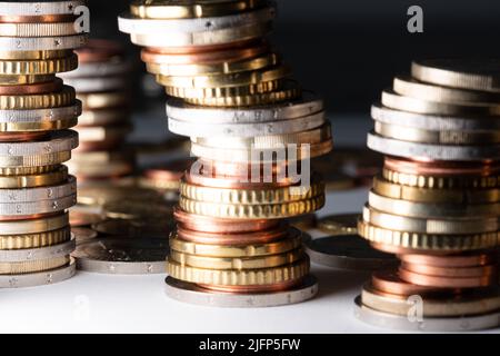 Stacked Euros leaning to the right. Euro coins in different sizes and denominations Stock Photo