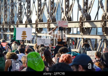 Various activist groups gathered at Cadman Plaza and marched over Brooklyn Bridge in New York City to demand justice for abortion, environment, black Stock Photo