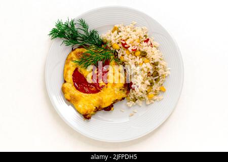 A portion of meat baked under cheese with tomatoes, herbs and rice with vegetables. White isolated background for design for your menu. Copy space. Stock Photo