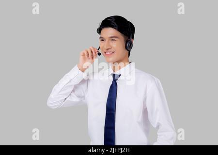 Portrait young asian business man call center wearing headset isolated on white background, agent with support and service, businessman is assistant f Stock Photo