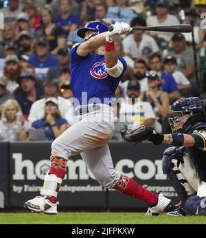 Milwaukee, Wisconsin. July 4, 2022, The Chicago Cubs' Seiya Suzuki (27)  slides safely home after hitting an inside-the-park home run in the ninth  inning of a baseball game against the Milwaukee Brewers