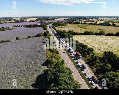 Colchester, UK. 04th July, 2022. (EDITORS NOTE: Image taken with drone) Traffic is blocked up along the A12 between Colchester and Chelmsford as protesters stage a go slow protest against the rising cost of fuel. Credit: SOPA Images Limited/Alamy Live News Stock Photo