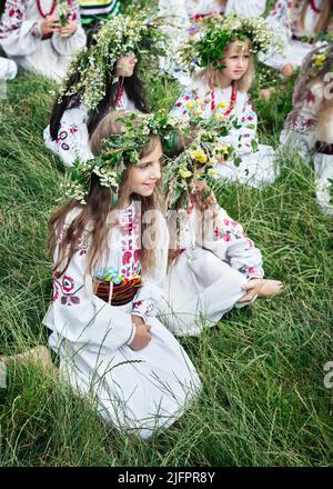 Teenage girls in Ukrainian national clothes and traditional flower