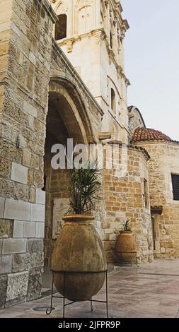 Beautiful old ancient tower with arch and plants of St.Lazarus church in Larnaca Stock Photo