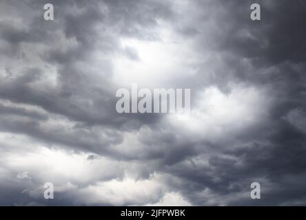Dark storm clouds before rain, with strange cloud shapes Stock Photo